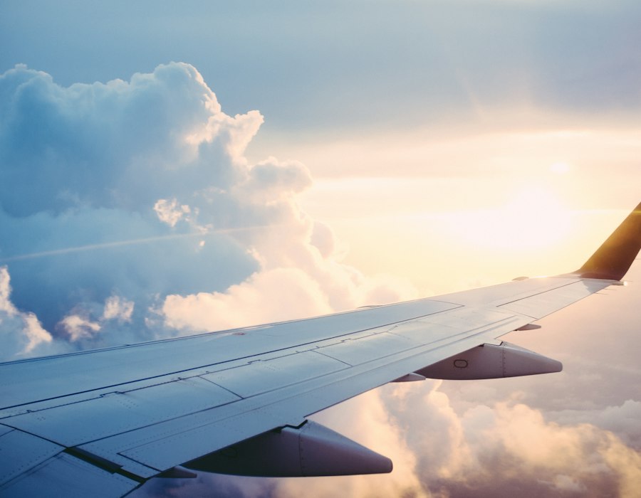 Airplane wing above the clouds